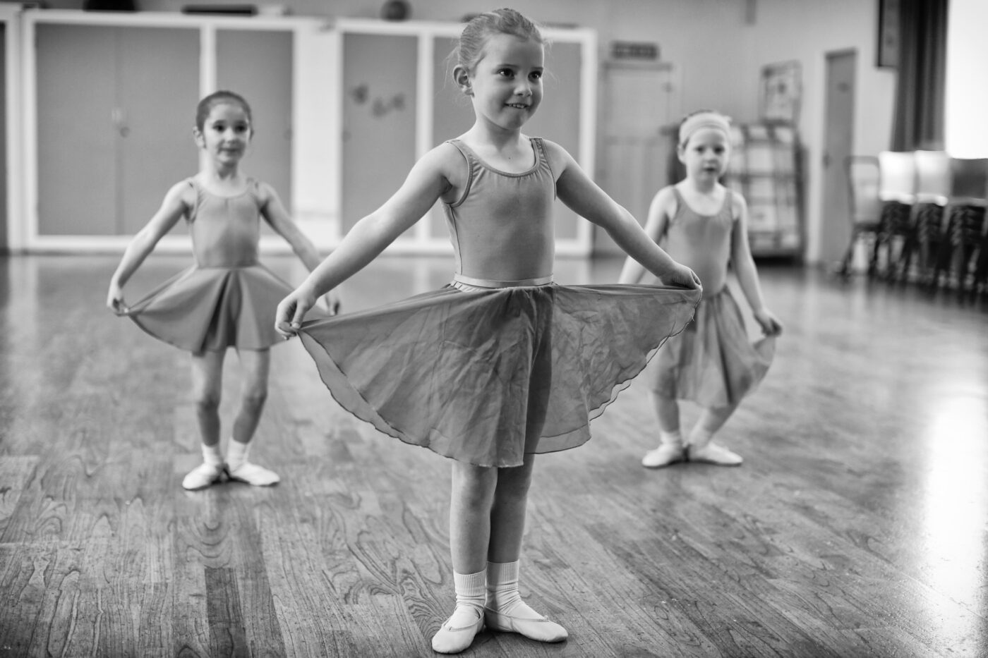 primary ballet girls holding their skirts