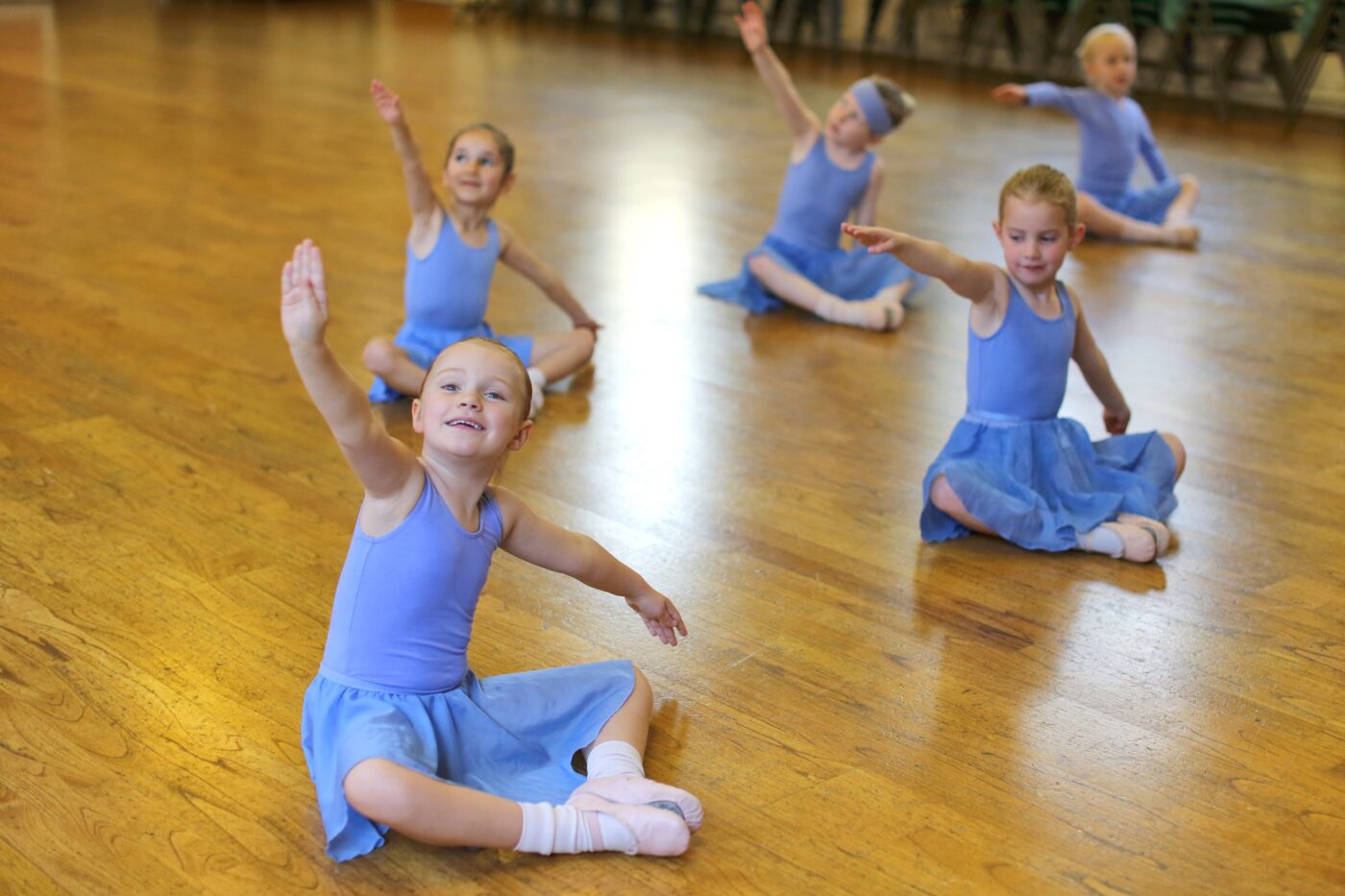 Ballet class of girls in Southfields, Wandsworth wearing their blue leotard uniform